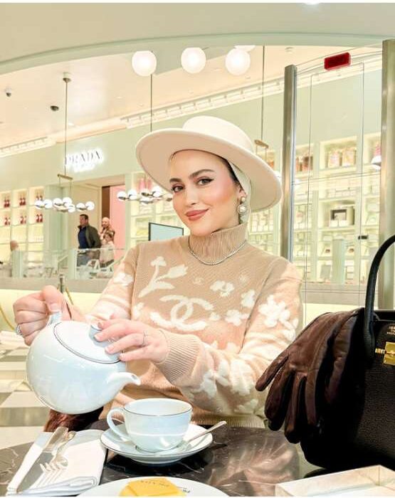 Kübra Toprak exploring an exclusive travel destination in elegant style